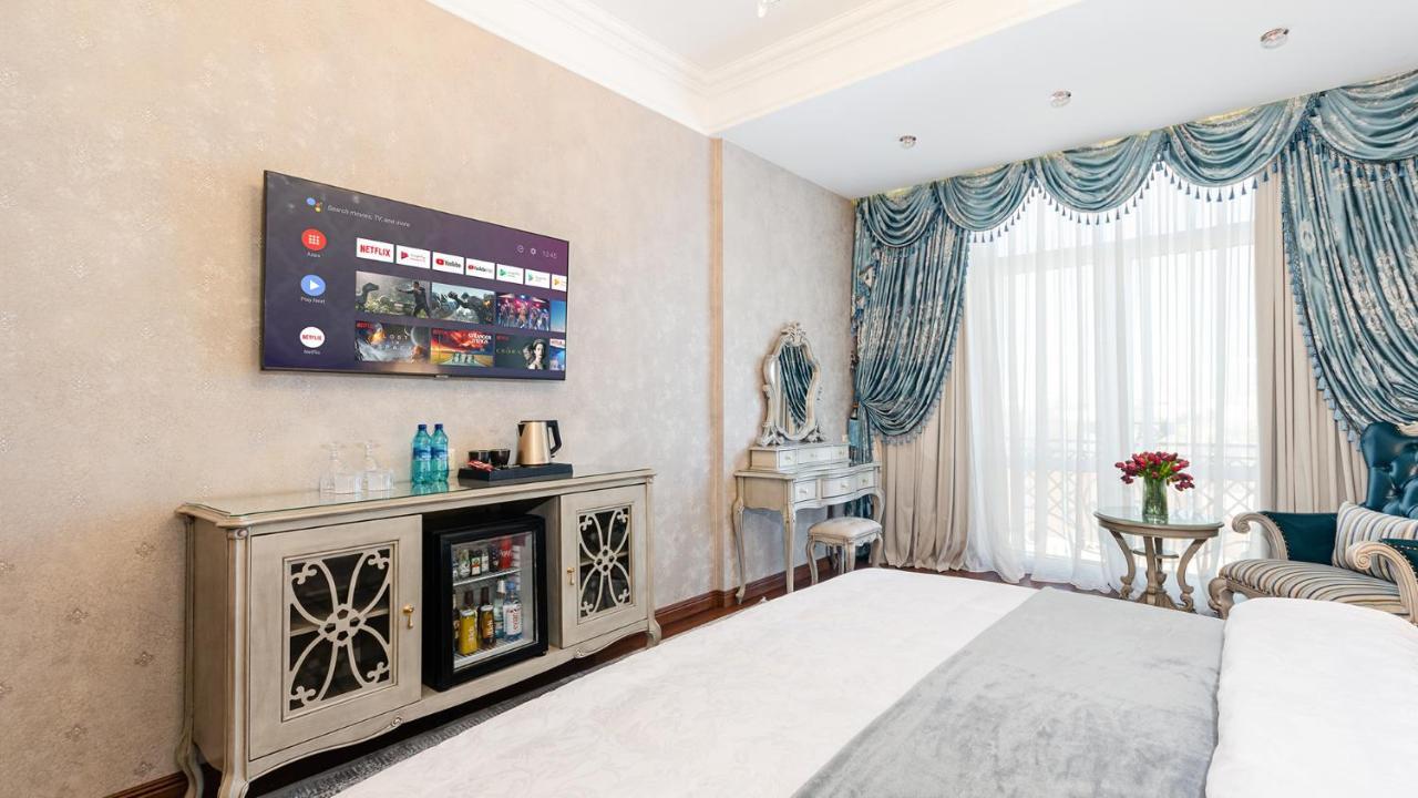 Gregory Boutique Hotel Chisinau Exterior photo A 4K UHD TV